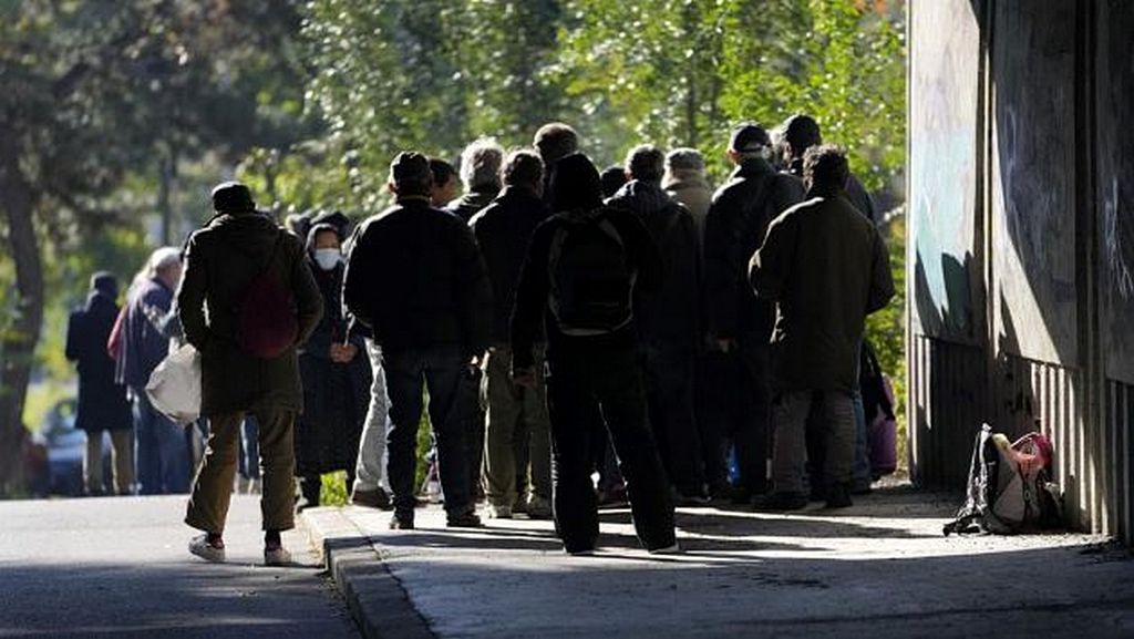 Homeless people in Belgrade wait in line to be assisted by ADRA Serbia volunteers. [Photo: ADRA Serbia]